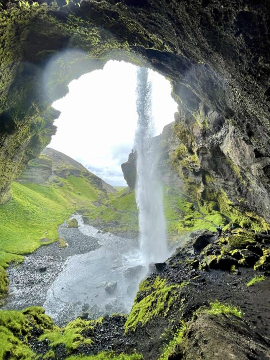 Waterfall in front of cave in Iceland